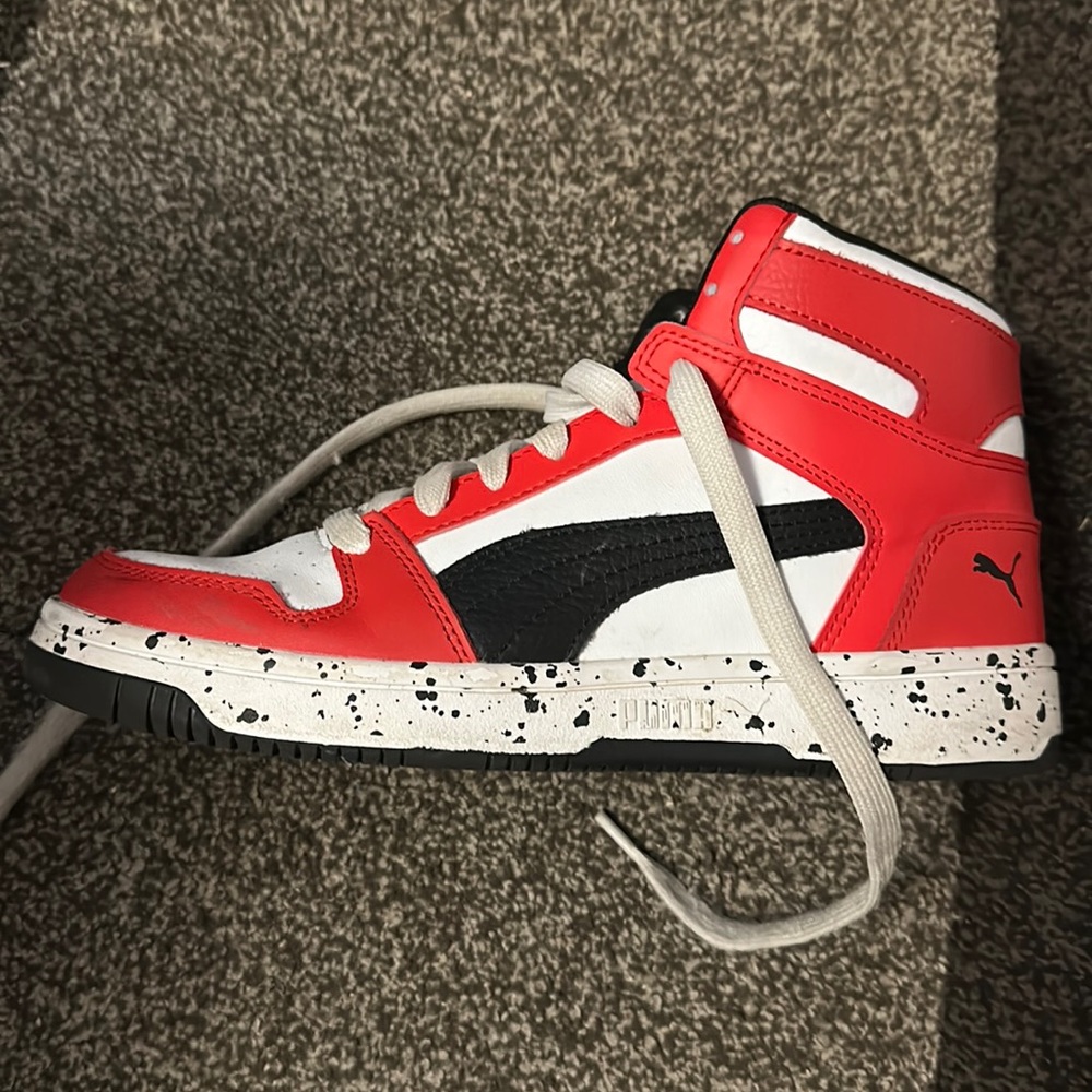White, Red, and black Puma